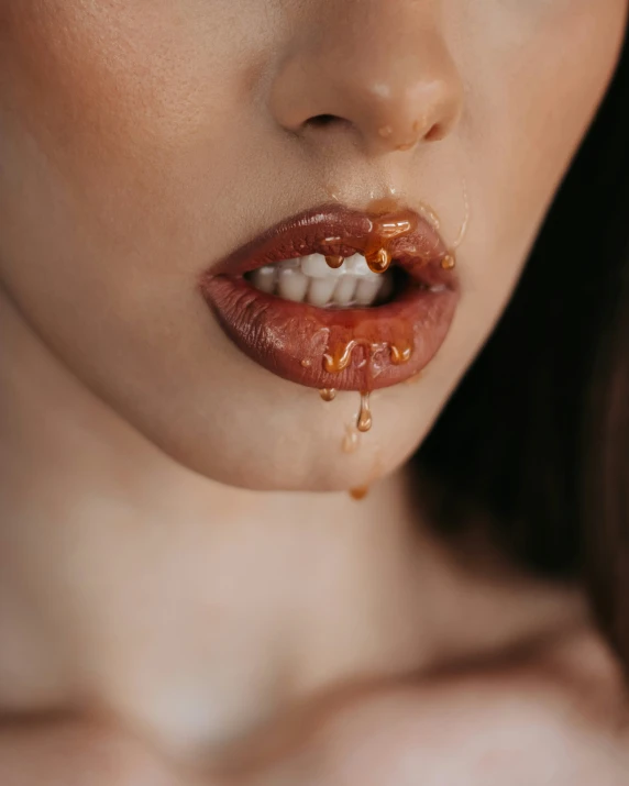 a woman's lip being dripping from a drip