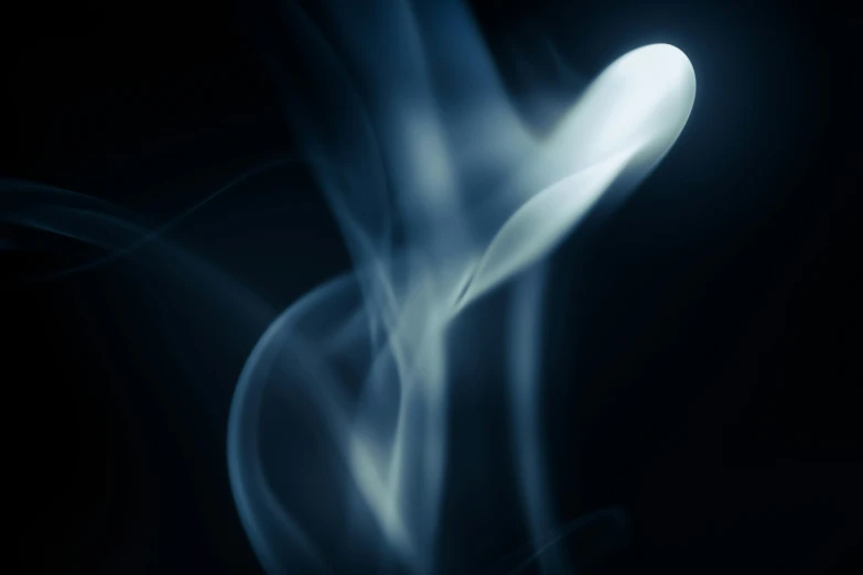 blue smoke is shown against a black background
