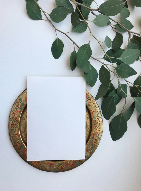 a blank sheet of paper on top of a place setting