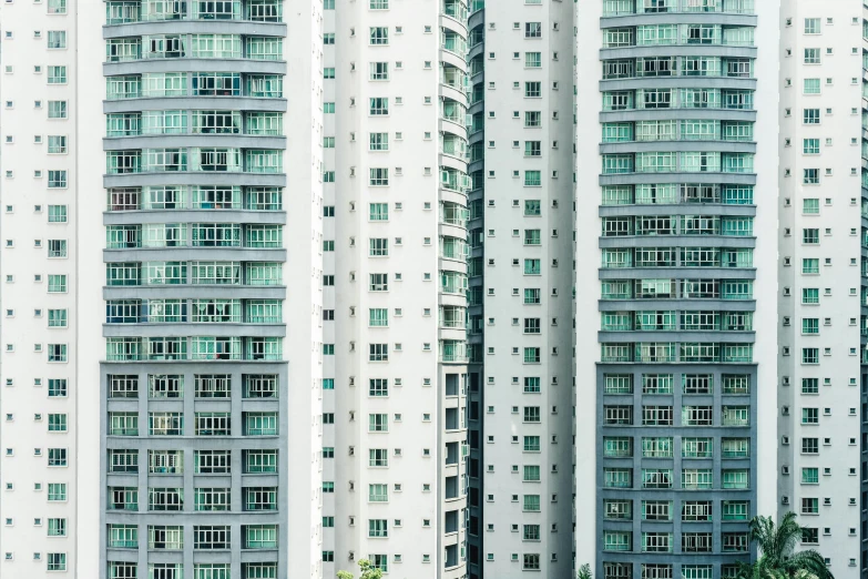 several buildings are very tall with a few windows