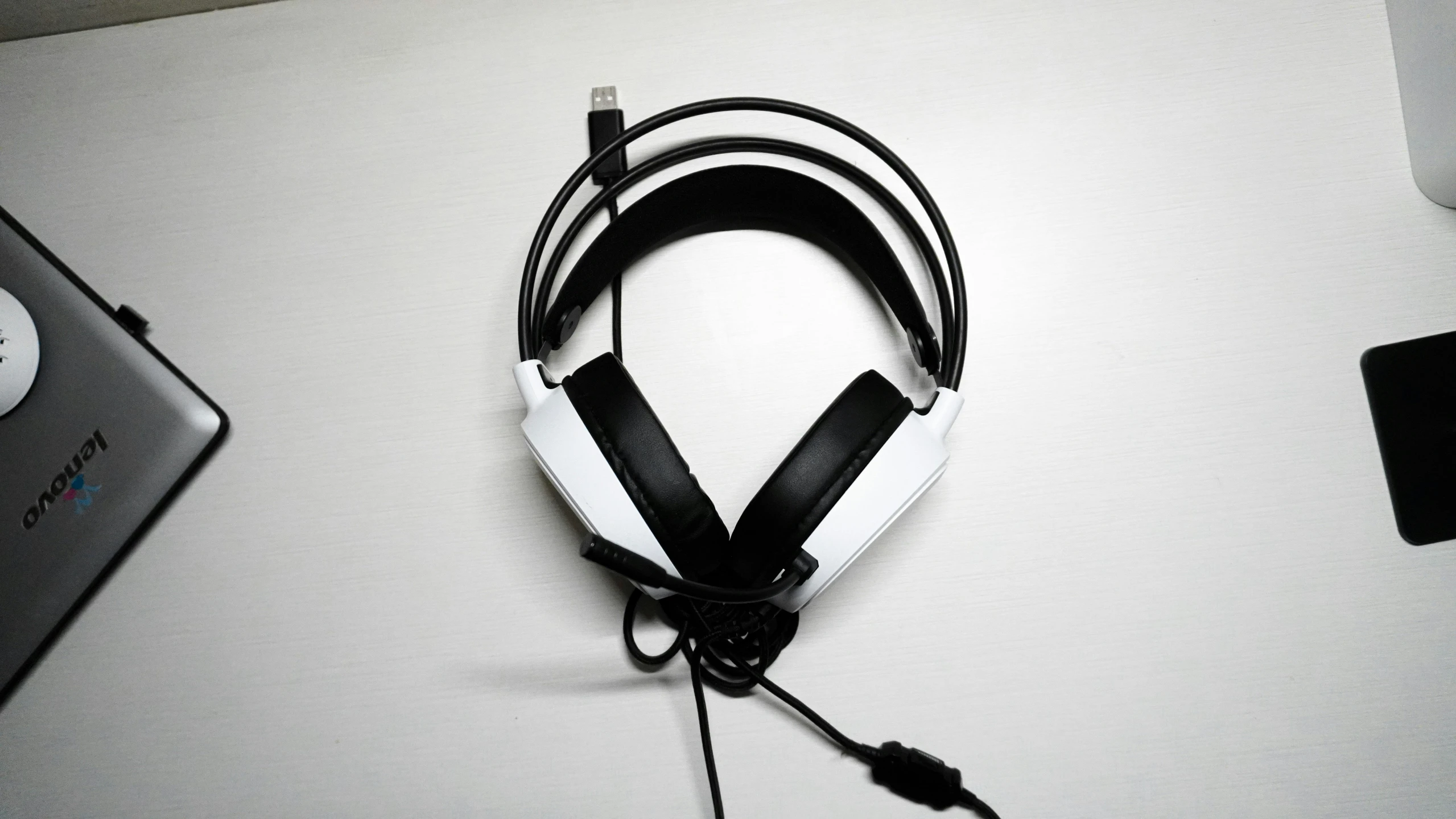 there is a computer headphone that is connected to the wall