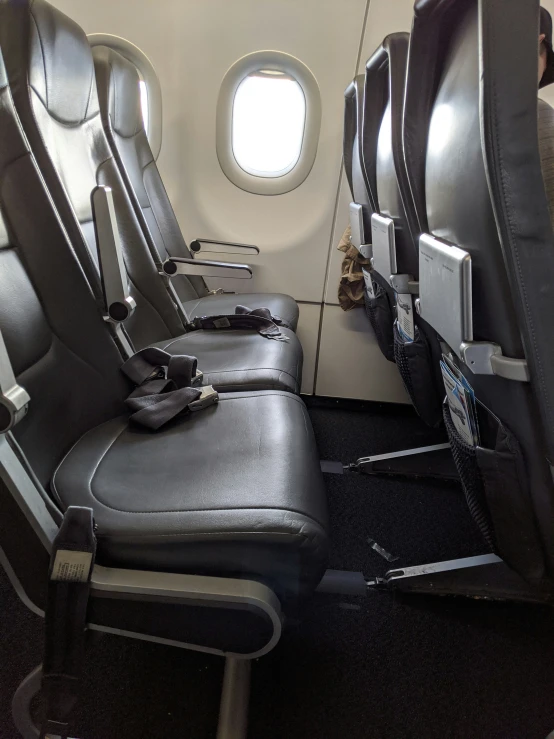 an empty seat in the aisle on an airplane