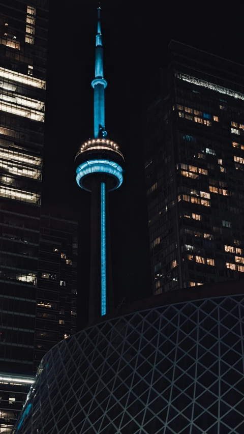 the cn tower is lit up blue for blue in support of world aids