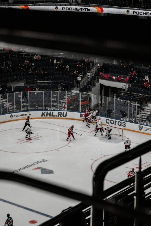 a hockey game with the referee watching