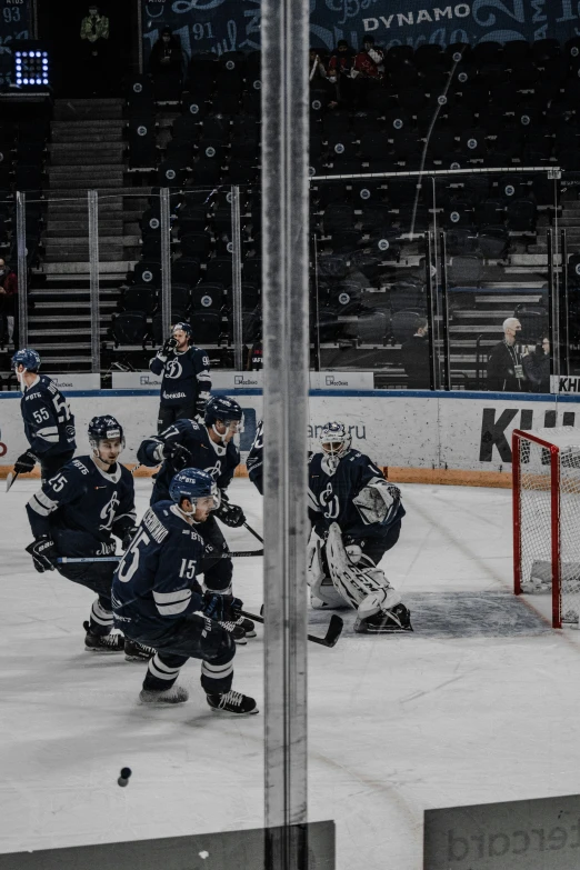 a group of young hockey players on an ice rink