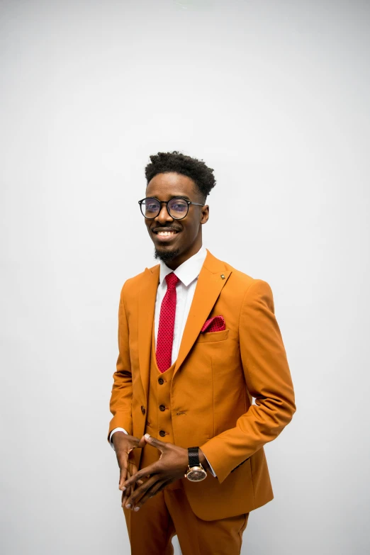 a person wearing an orange suit and tie