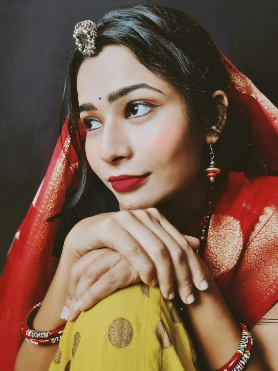 a portrait of a woman wearing jewellery