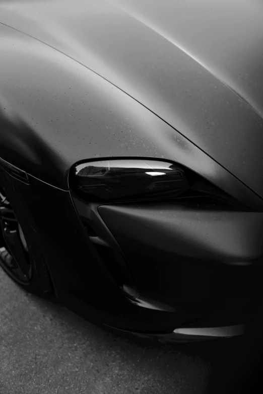 the face of a parked car in black and white