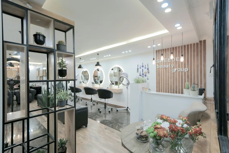 an open hair salon with some tables on the floor