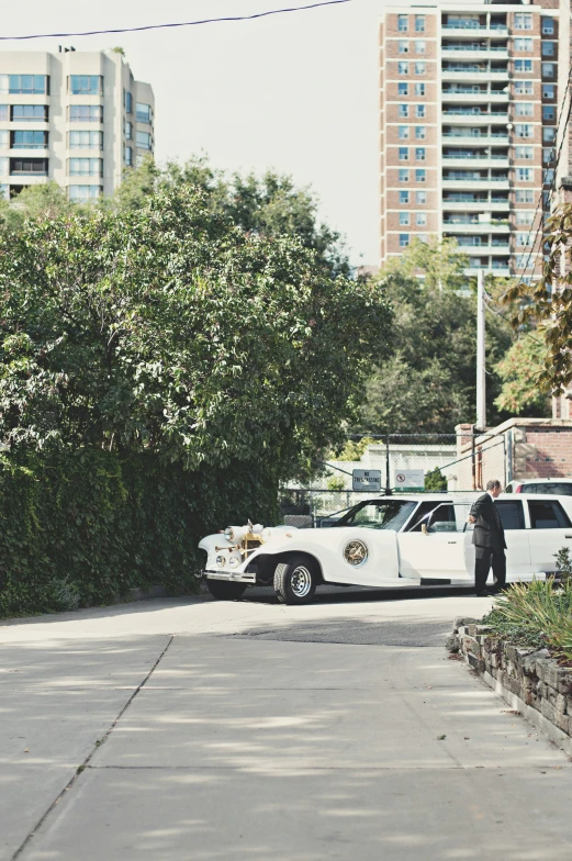 police car parked near a city street in front of buildings