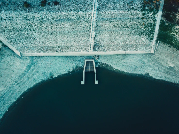 an aerial s of a small pool near the water