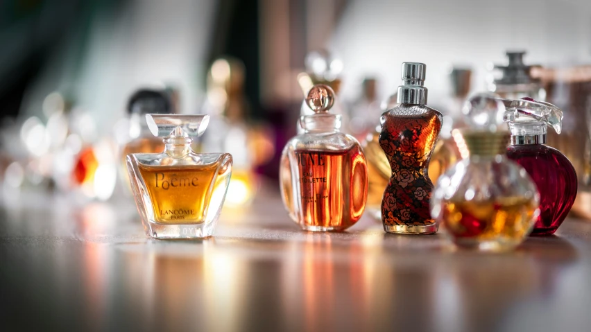 a group of perfume bottles sitting on top of a table