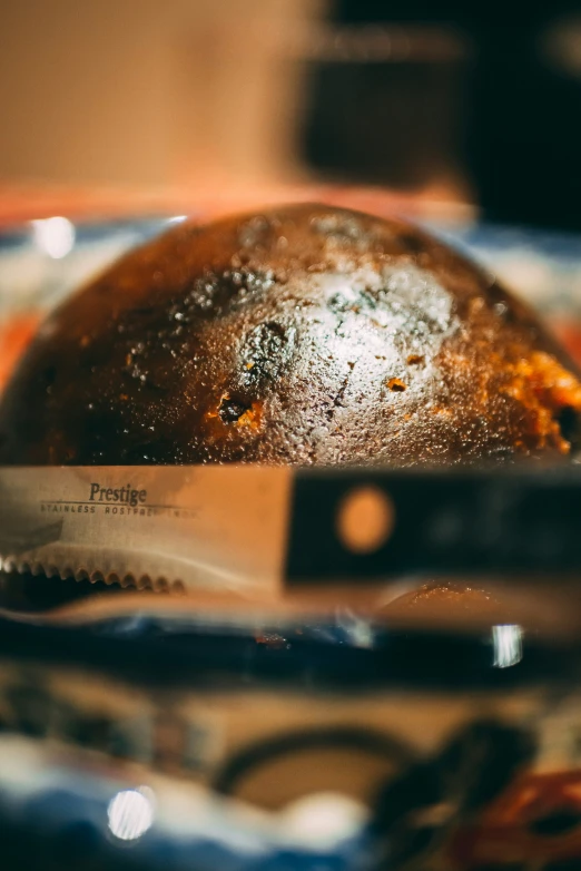 a close up of a cake on a plate with a knife