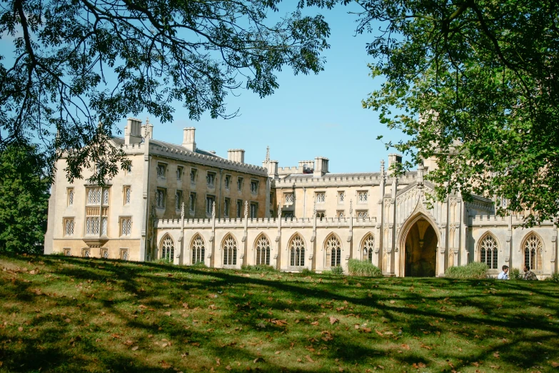 this mansion has an elaborate front entrance and clock on the top