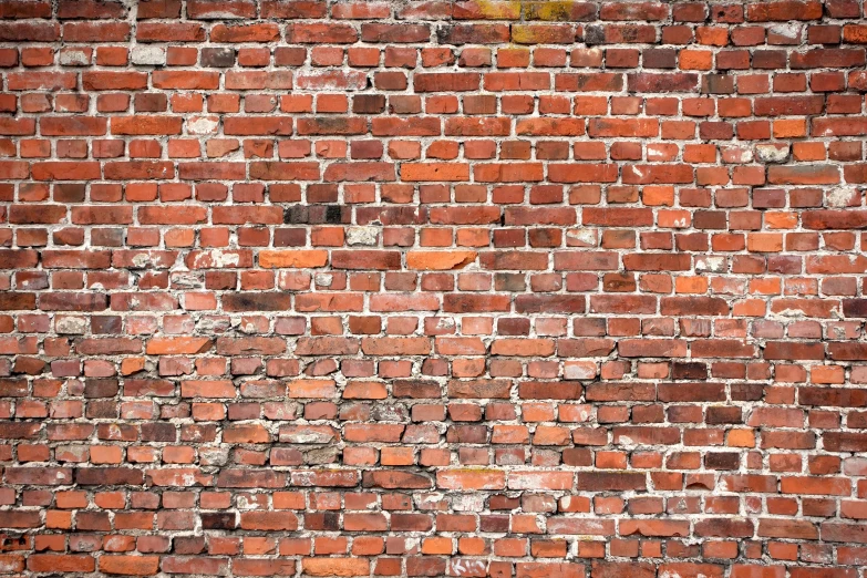 a wall that has some red bricks on it