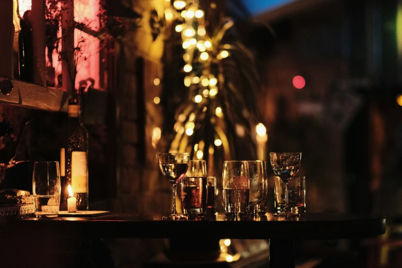 candles are set on a table with champagne glasses