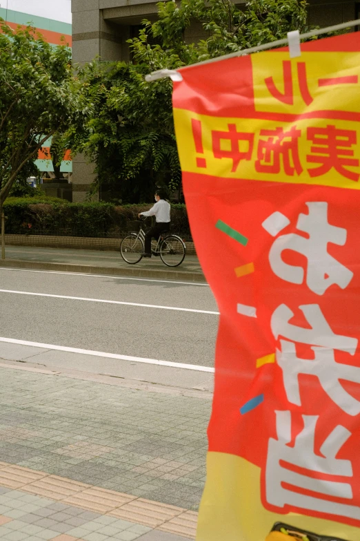 a man on a motorcycle driving down the street