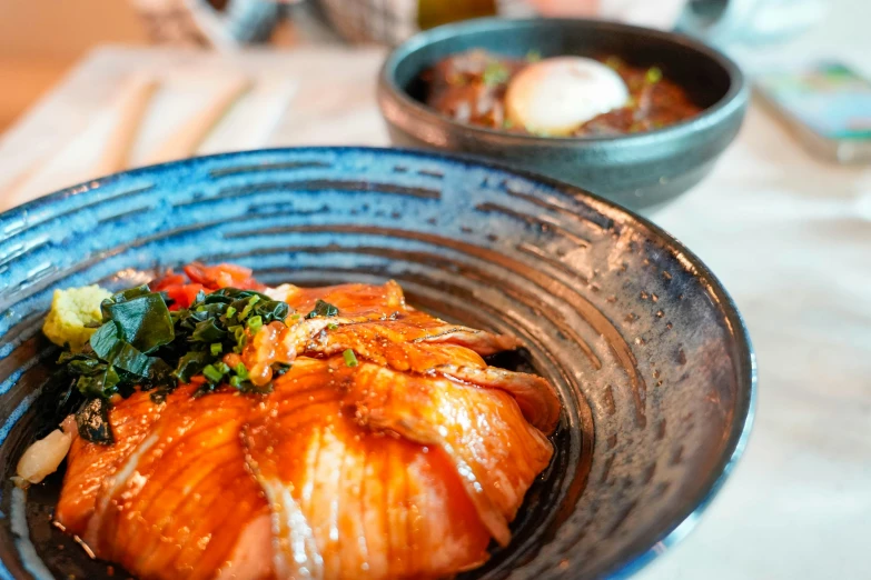 a bowl is filled with seafood and vegetable