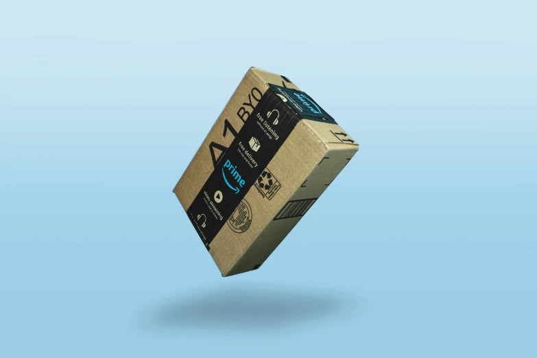 a cardboard box that is on the floor in front of a blue background