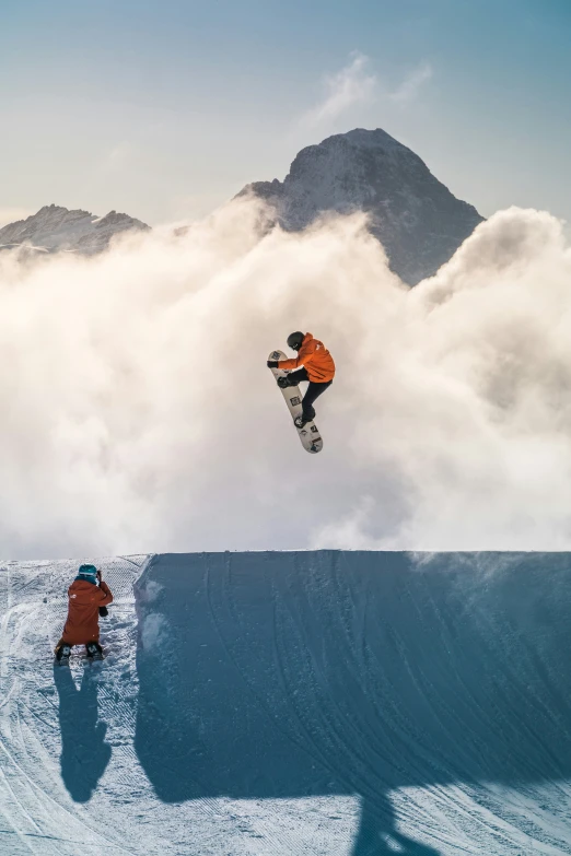 a man in the air on his snowboard