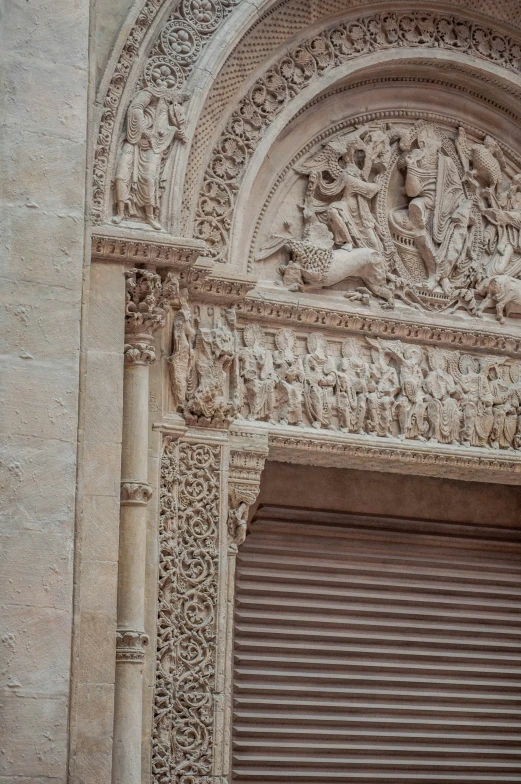 a large building with ornate carving on the outside