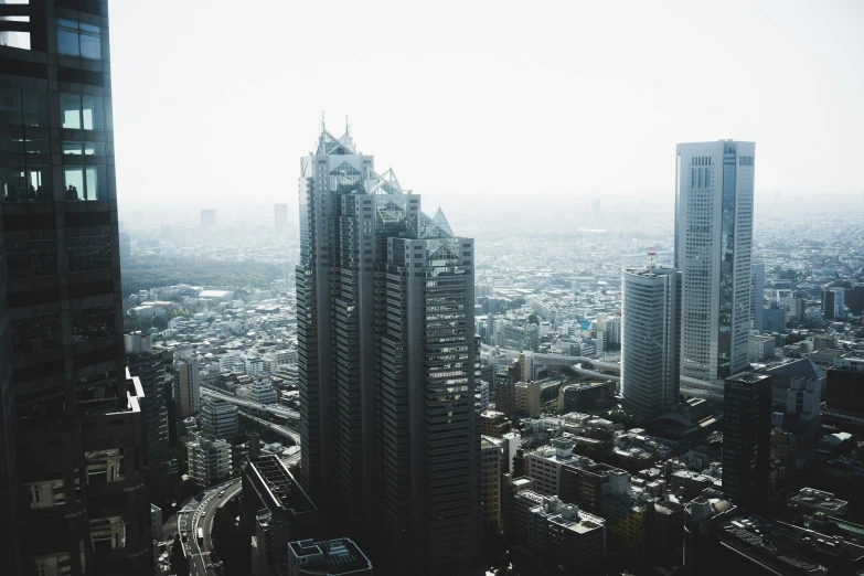 the city buildings and buildings with a very hazy sky