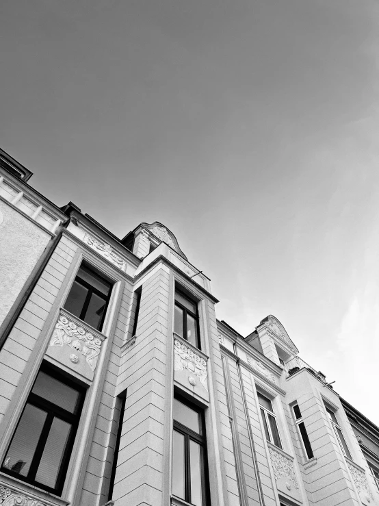 a black and white po of a building with a clock