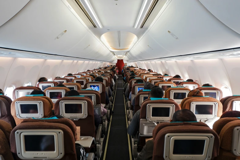 empty seats and windows inside an airplane