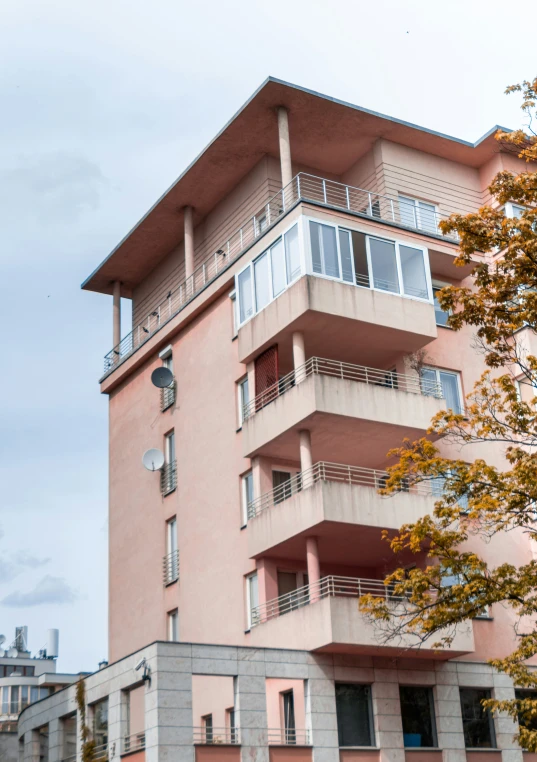 a tall apartment building with balconies on the balconyes