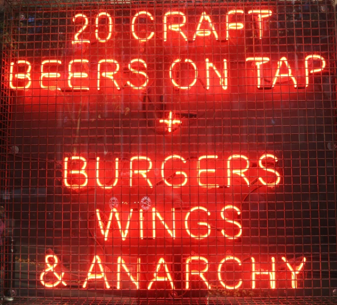 neon sign indicating the dangers of beer and awnings