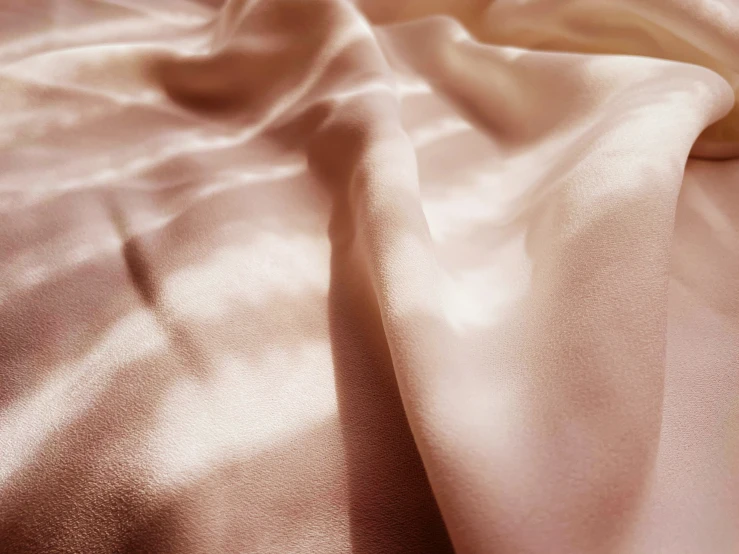 the light colors of a silk fabric are seen