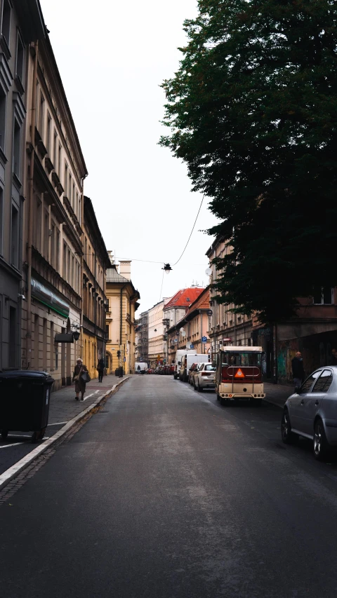 cars parked in side streets between two buildings