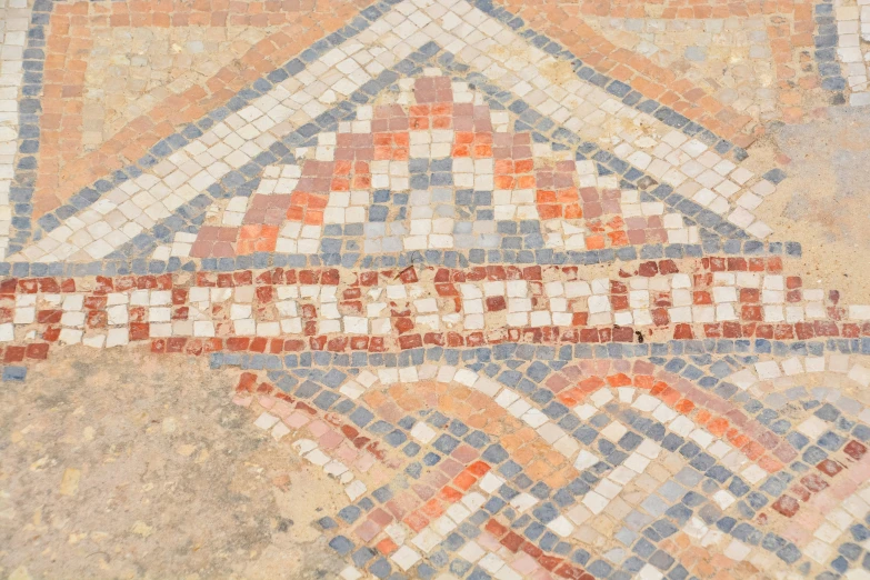 an old looking floor with tiles in the middle