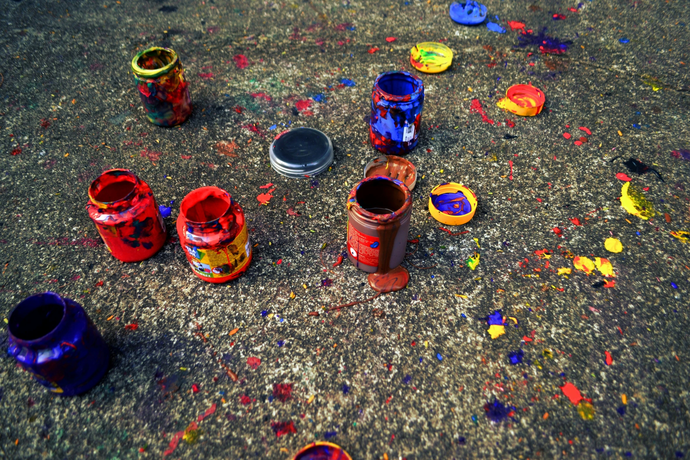 these paint cans are laying in the street