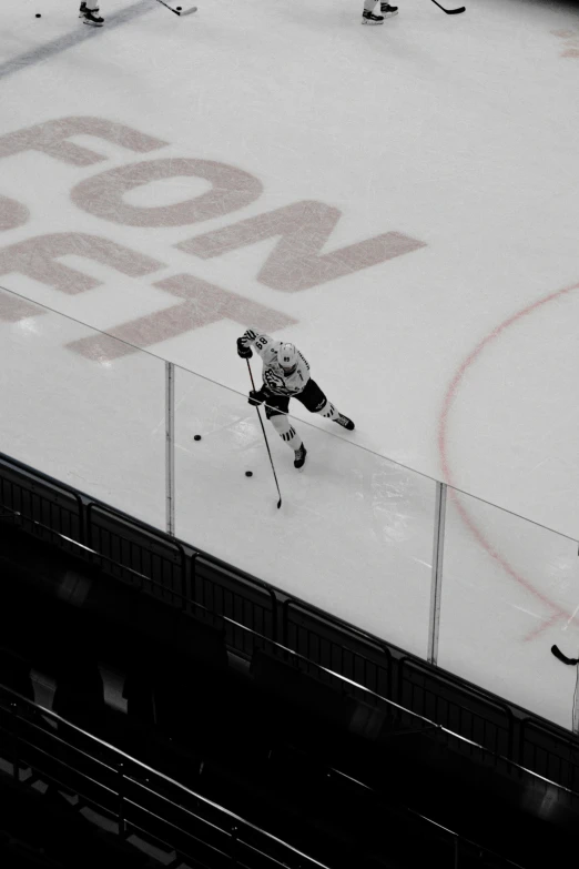 some hockey players playing on a ice rink