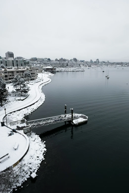 the snow is piled onto the water and has frozen on it