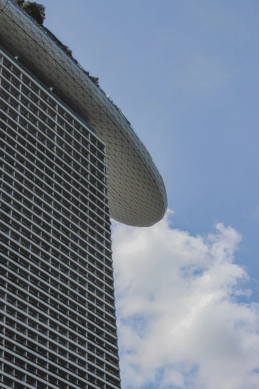 the top of a building, featuring a large circular hole on it