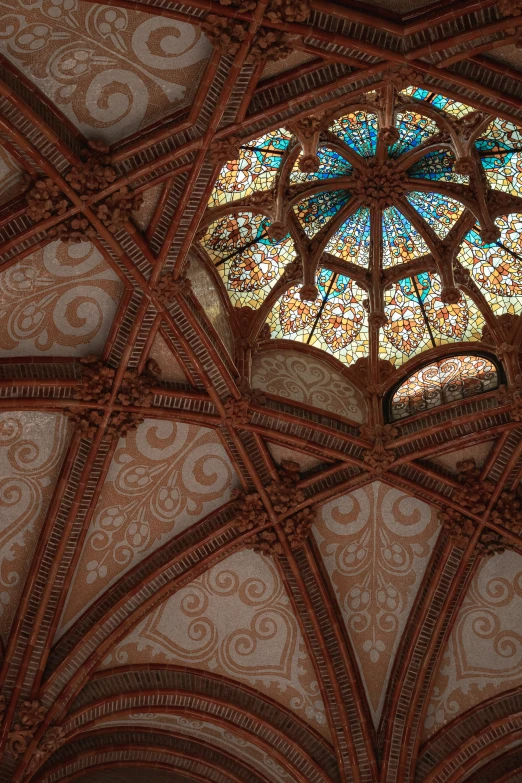 the interior of a cathedral with a round stained glass window