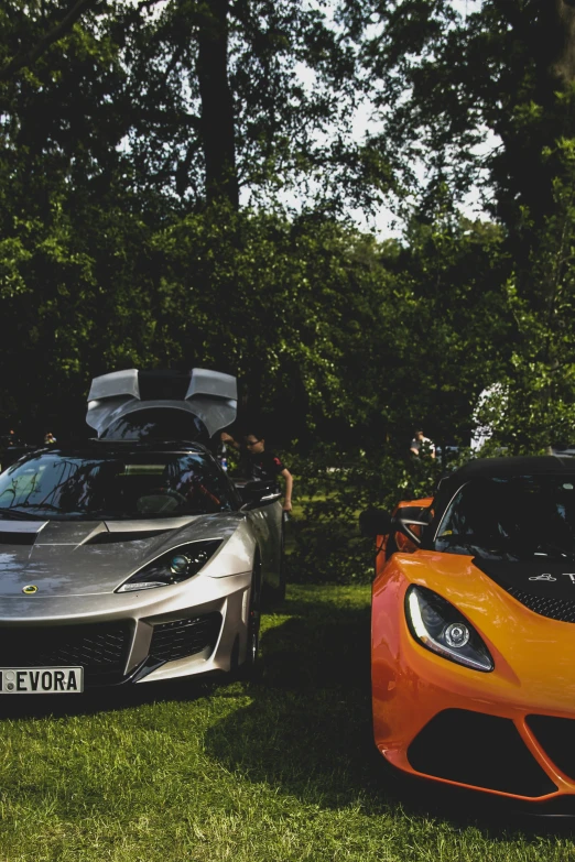 two sports cars that are side by side