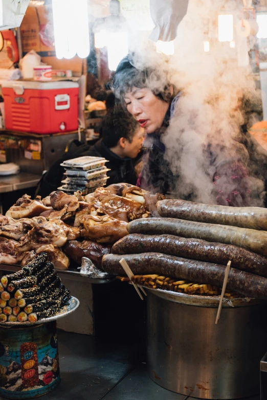 a woman cooks food inside of a frying pan