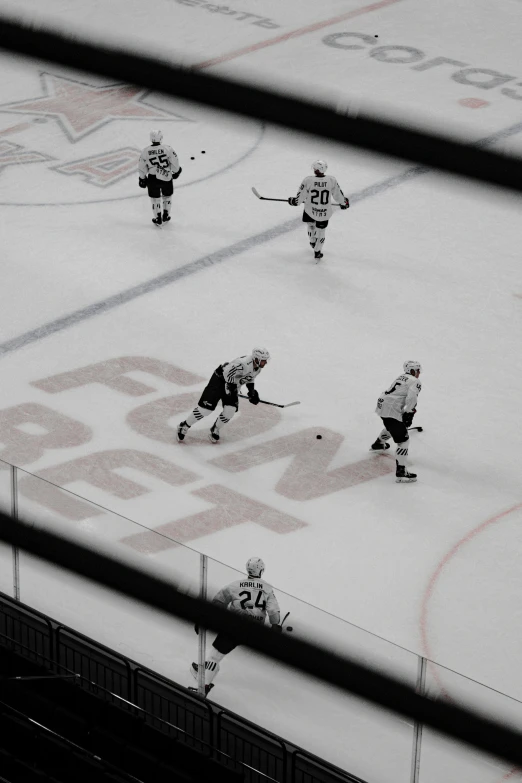 an image of a hockey game going on in the rink