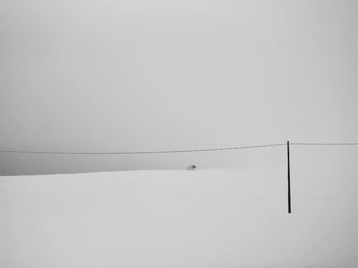 a lone power line in the distance and a single building across the middle of nowhere