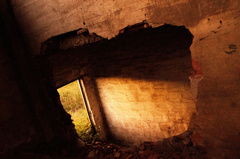 an old rusted brick wall in a room