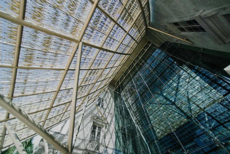 several different shades of glass with a building in the background