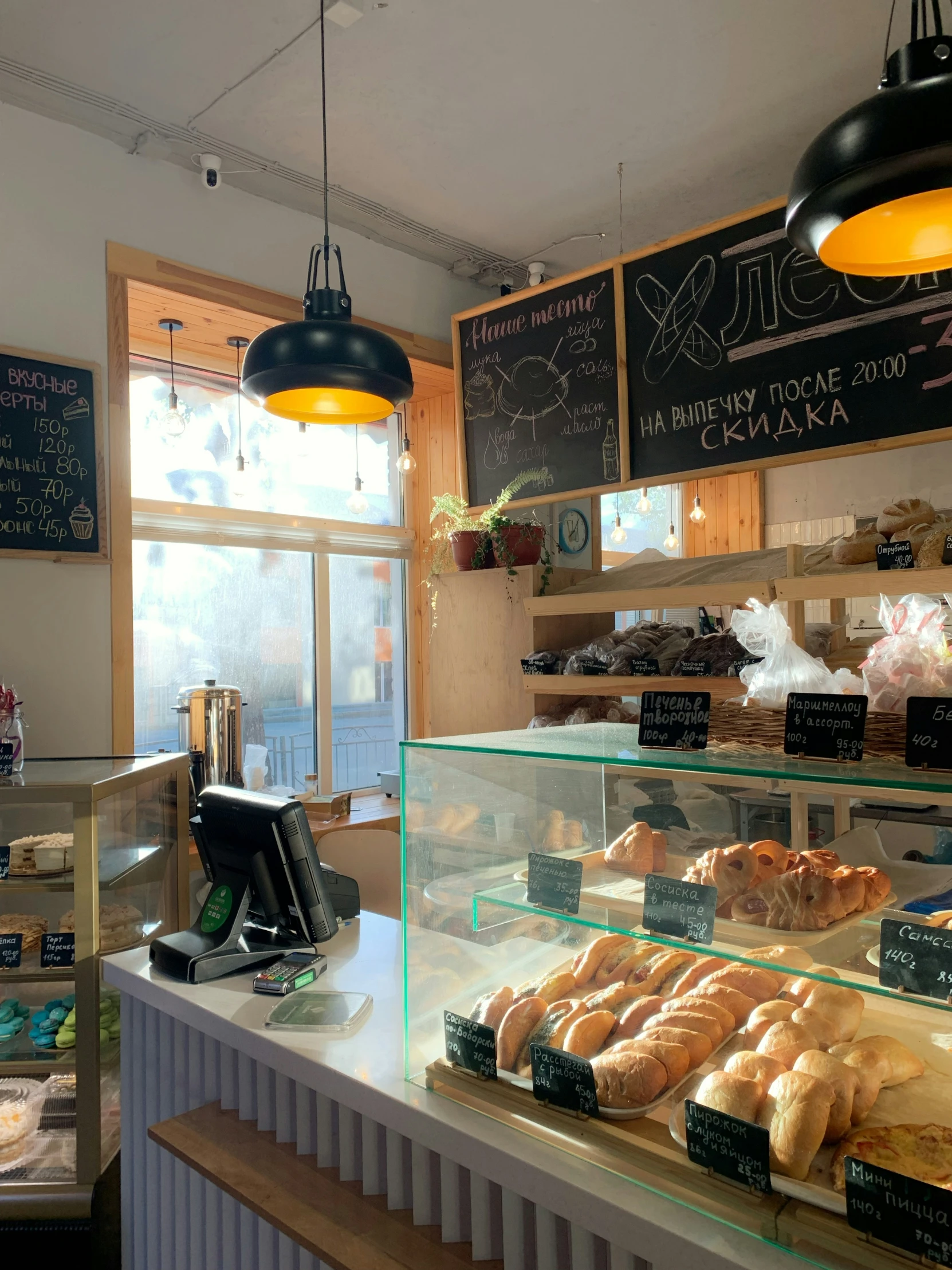 a bakery counter that has various baked goods on the shelves