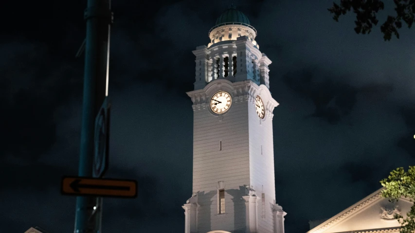 a night time s of a clock tower lit up