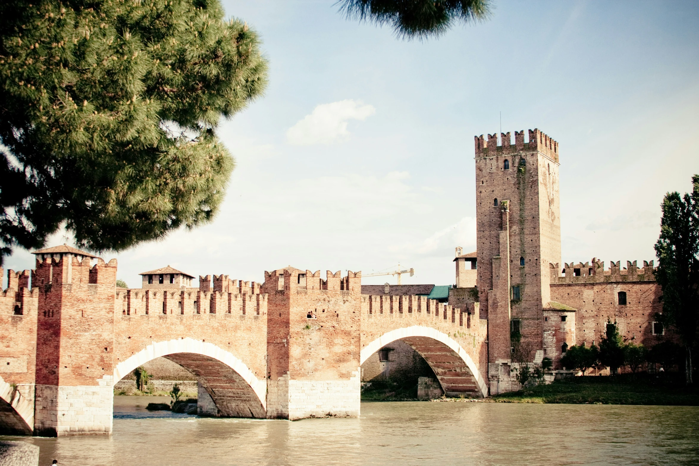 this is an image of a castle with a bridge in the foreground