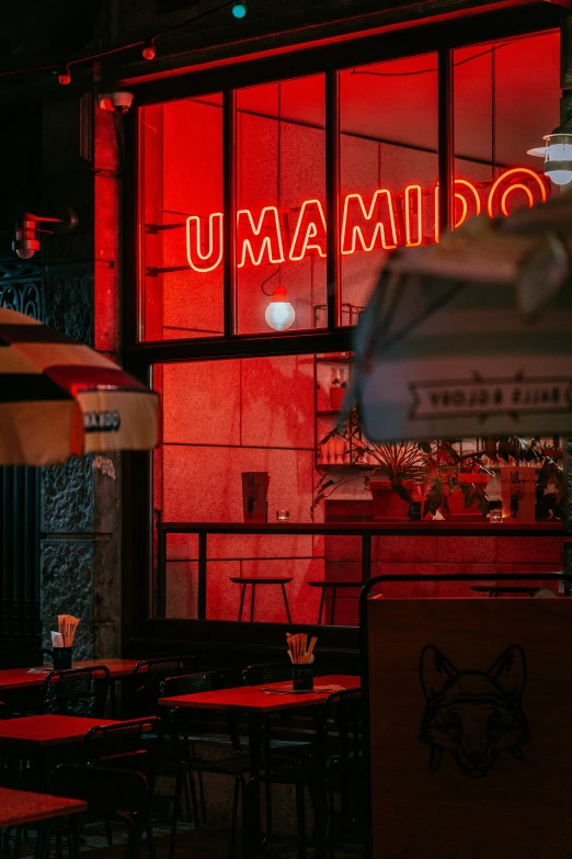 an outside view of the building with illuminated neon signs