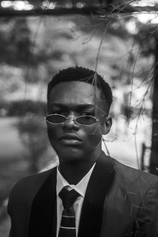 a man in glasses and suit and tie