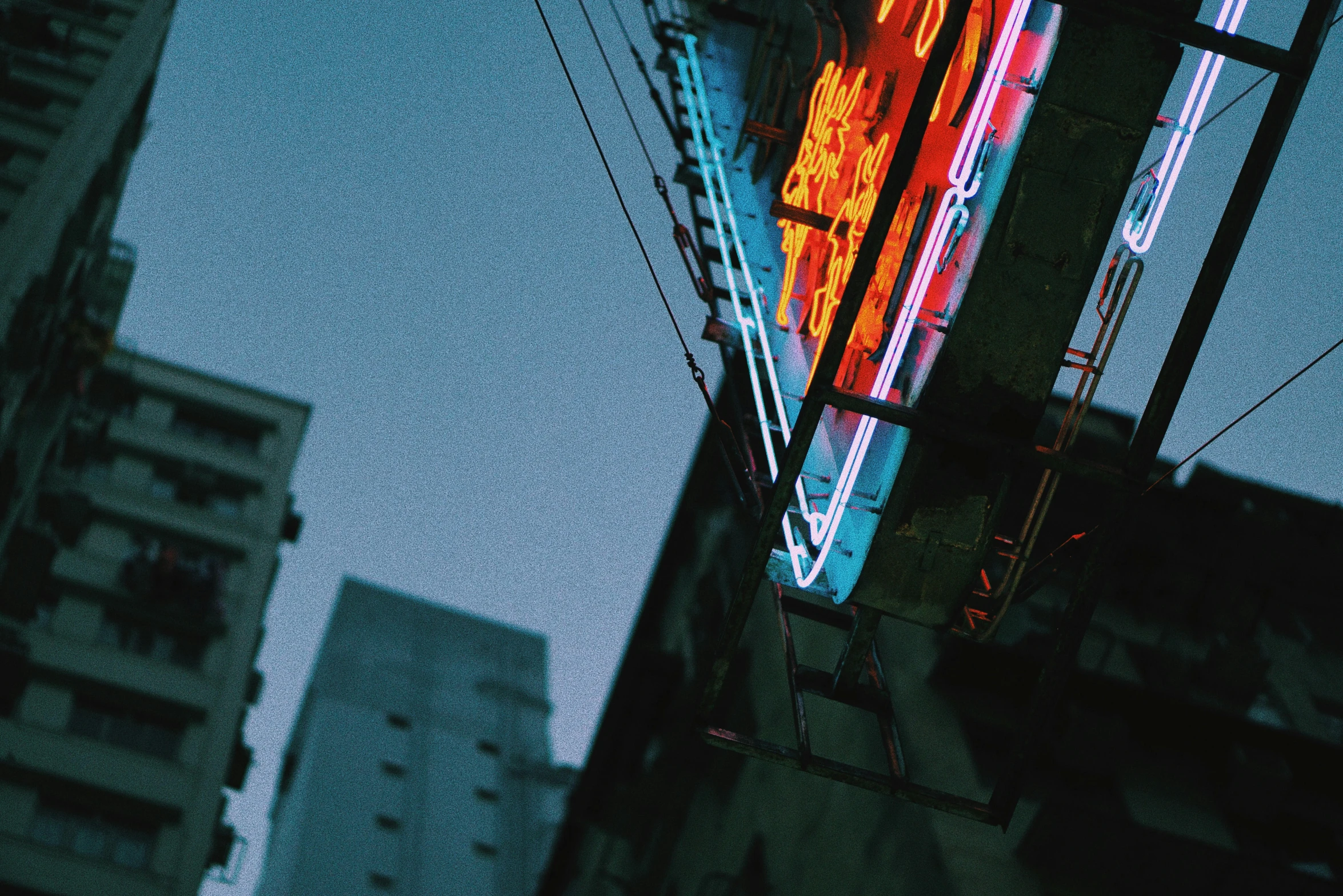 the view of some buildings in the city from below